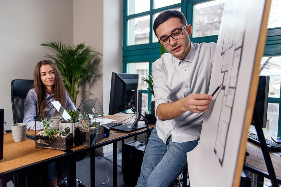 Man showing he's ready to take on more responsibility at work by leading a tough project.