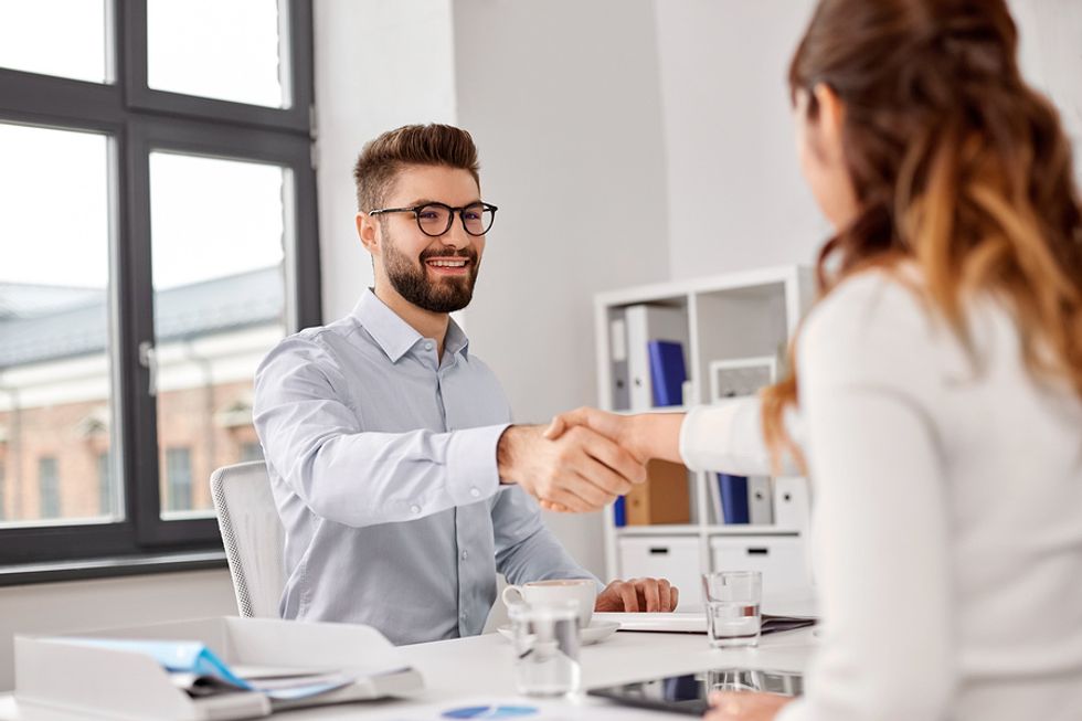 Man getting offered a job after he joined Work It Daily's career growth club and took its career advice and utilized its job search strategy.