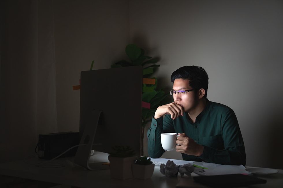 Unemployed man researching Work It Daily's career growth club.