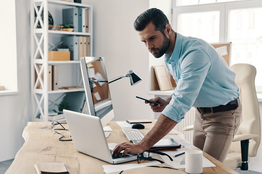 Man fixing his resume and tailoring it for a leadership role.