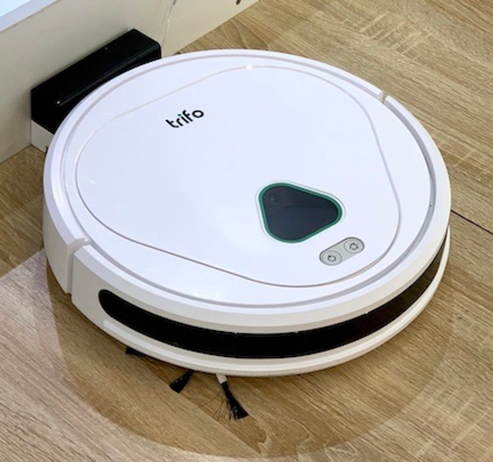A white robot vacuum cleaner with "trifo" written on top