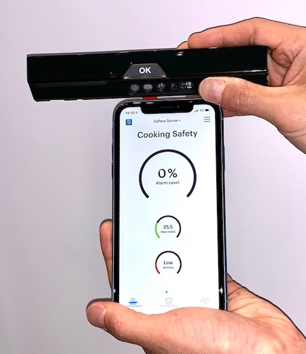 A smartphone showing a screen that says Cooking Safely