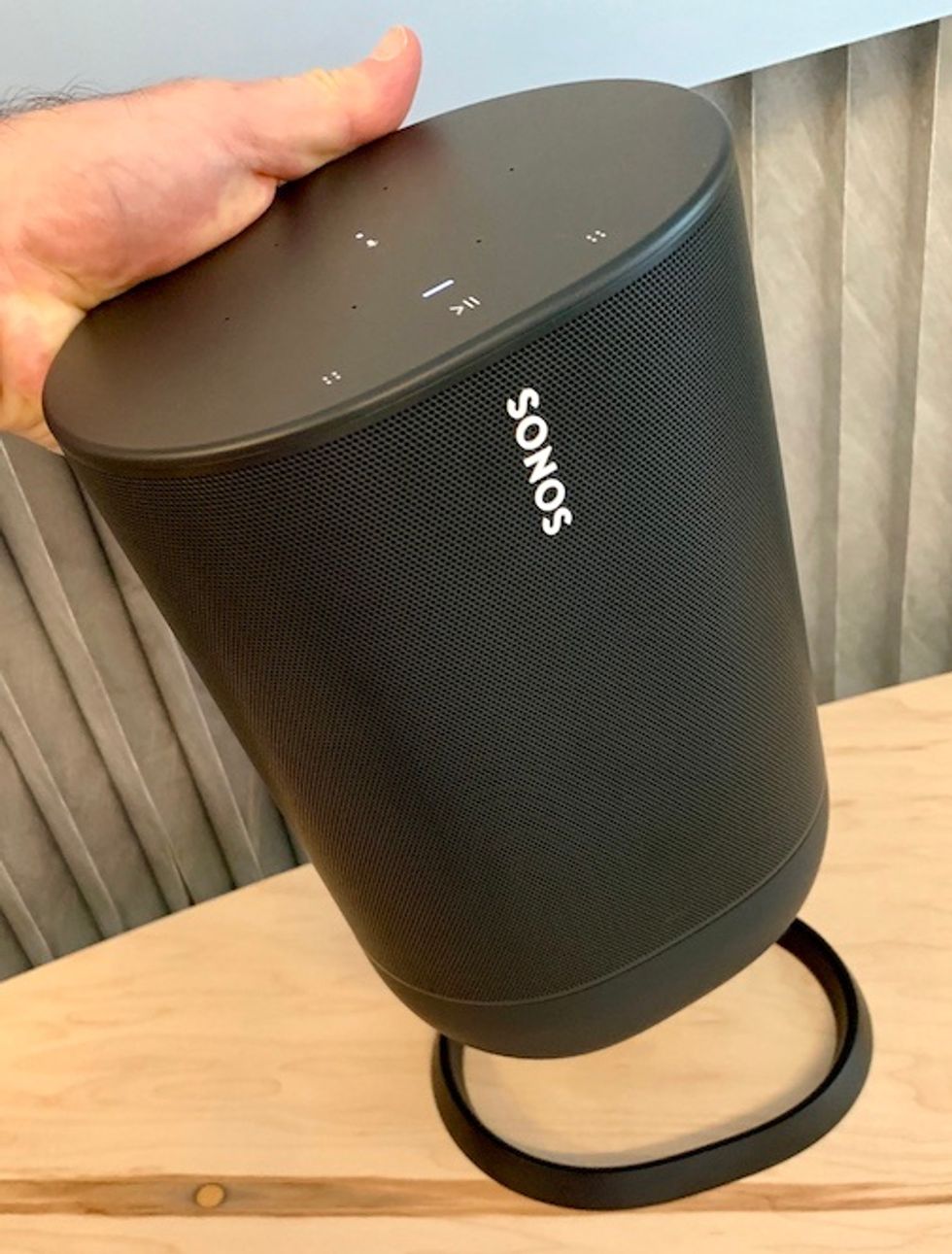 A Sonos portable, tall, black speaker