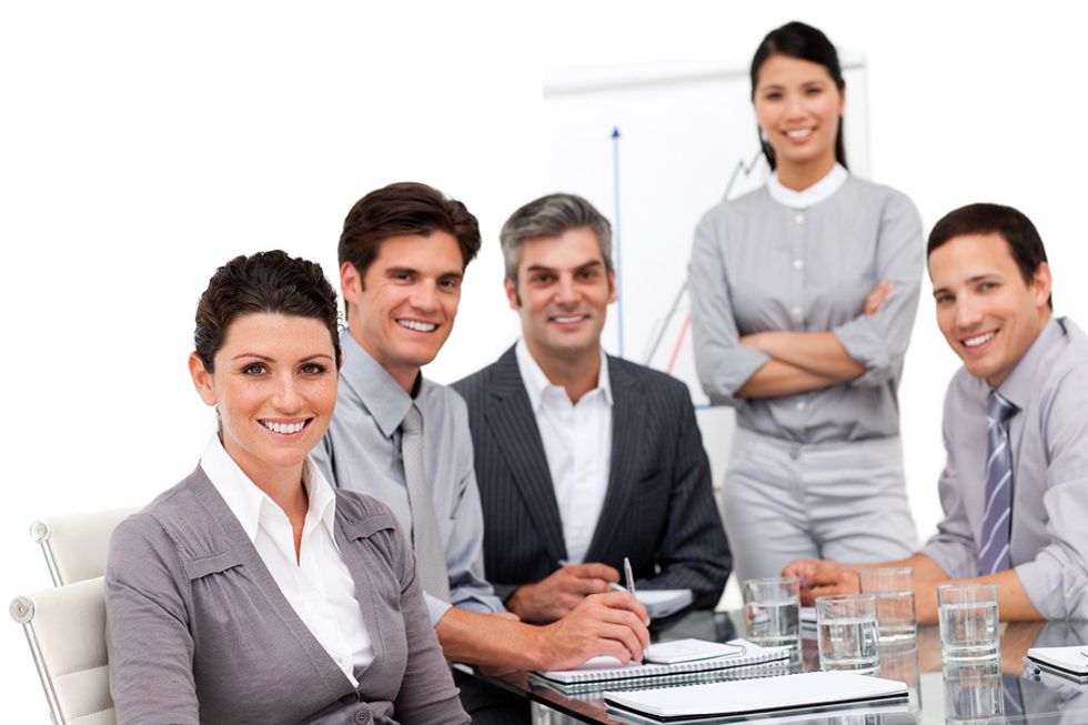 \u200bCompany leaders gather together to talk business.