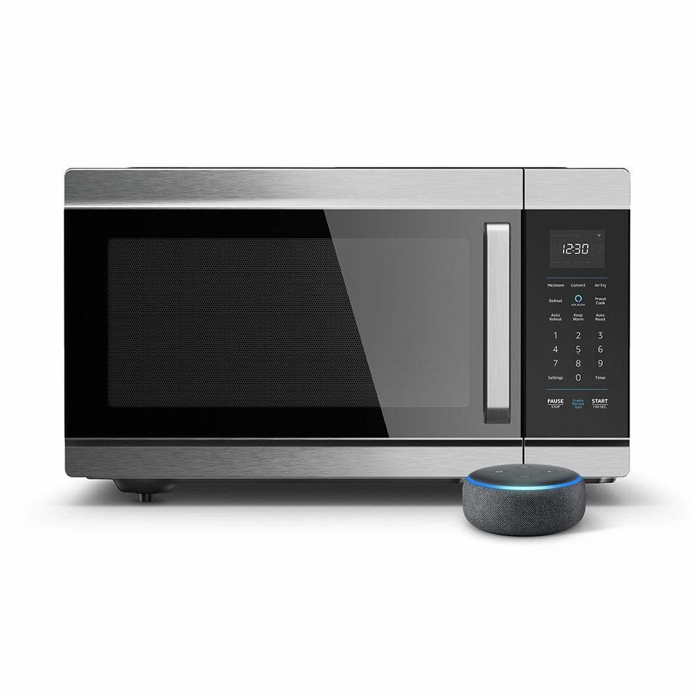 The Amazon Smart Oven, with an Echo Dot in front of it