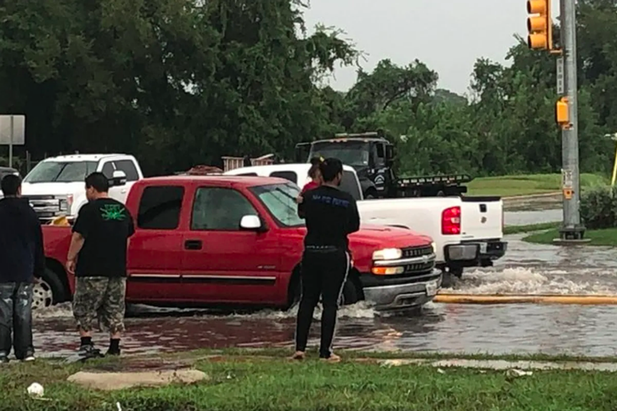HEROIC MOMENT: Aldine running back Jayden Payne pulls woman, child from flood waters