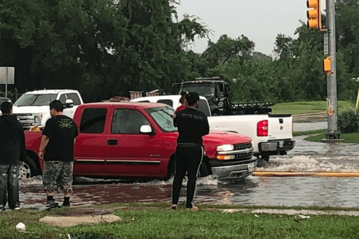 HEROIC MOMENT: Aldine running back Jayden Payne pulls woman, child from flood waters
