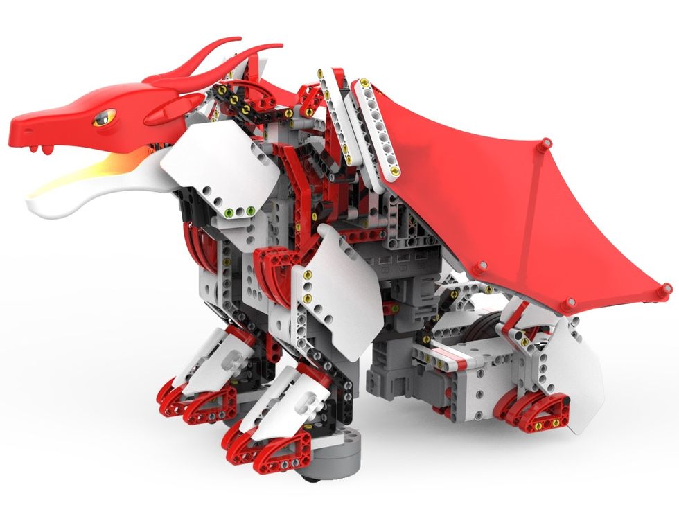 The UBTECH Jimu FireBotKit, a red and white toy dragon robot against a white background