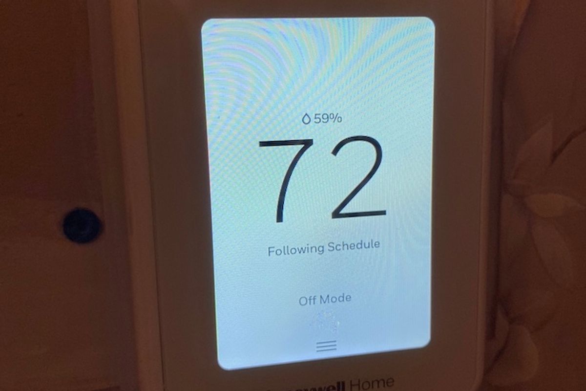 Photo of Honeywell Home T9 smart thermostat on the wall.