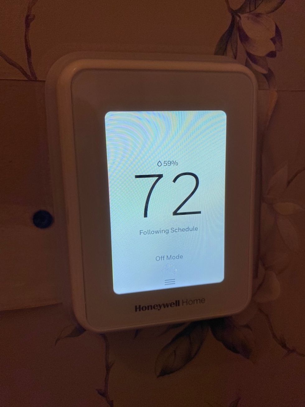 Photo of Honeywell Home T9 smart thermostat on the wall.