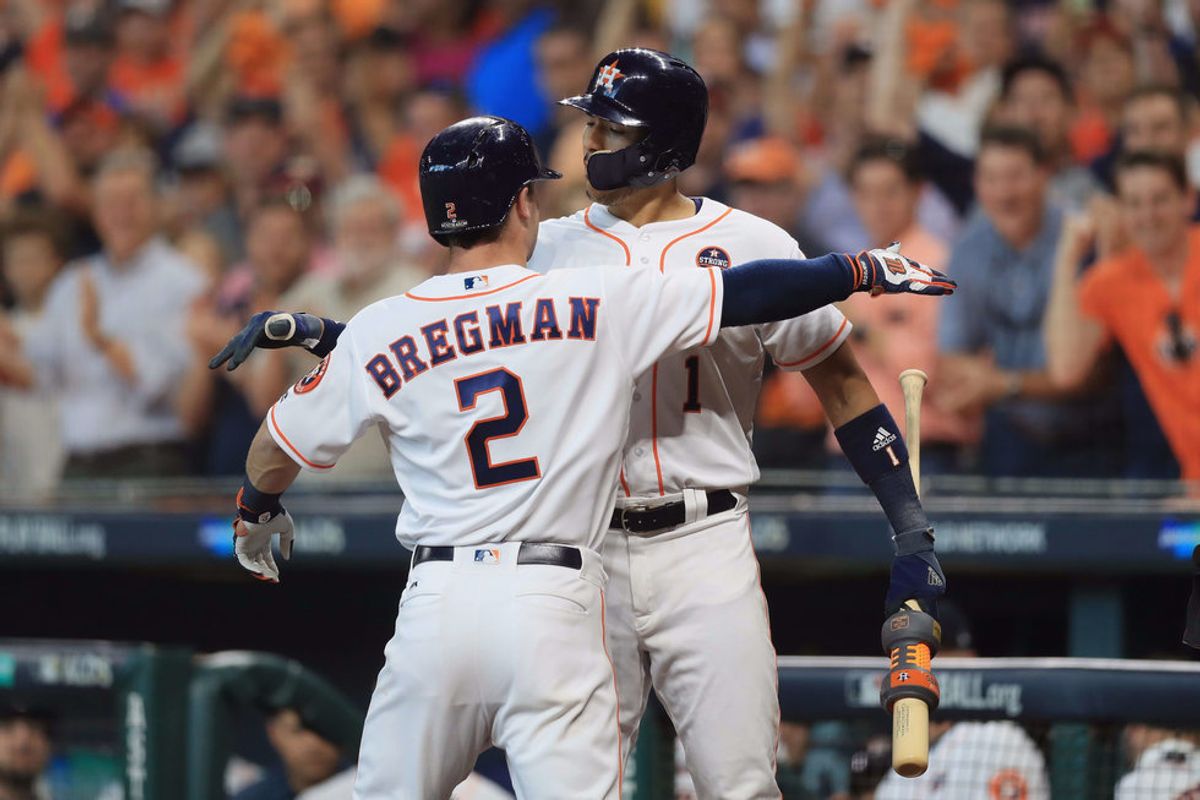 Alex Bregman and Carlos Correa celebrating in game one of the ALDS