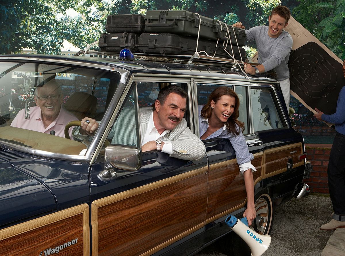 Cast of Blue Bloods in station wagon 