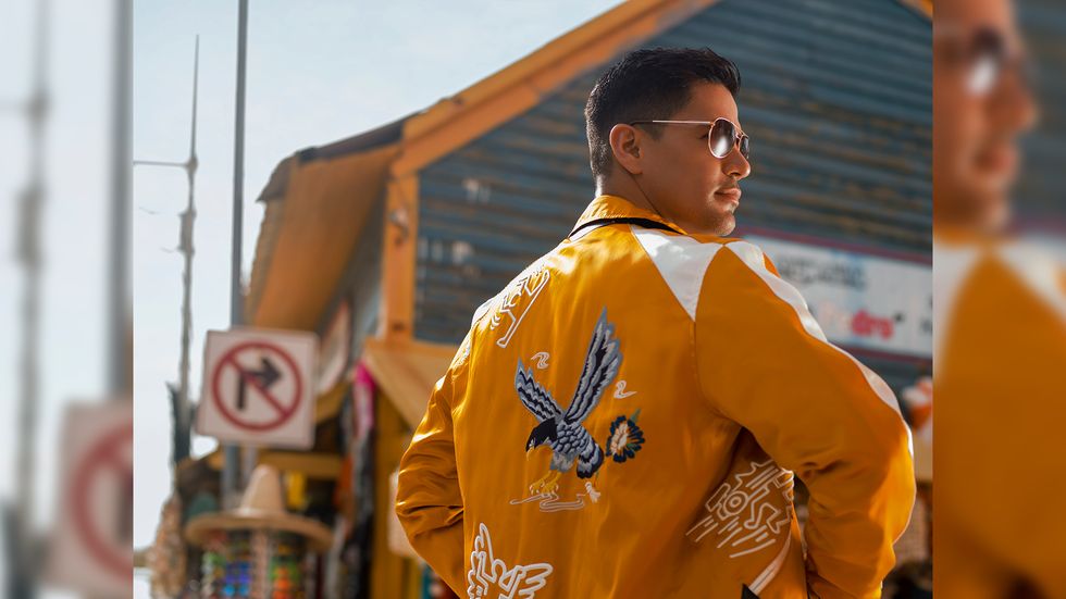 Jay Hernandez in yellow jacket with sunglasses