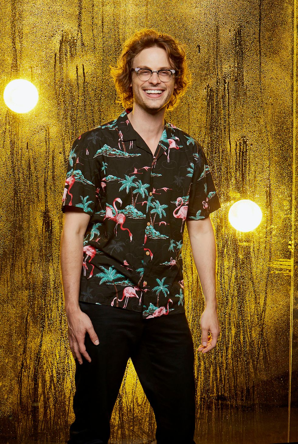 Matthew Gray Gubler of Criminal Minds in tropical shirt with palm trees and flamingos