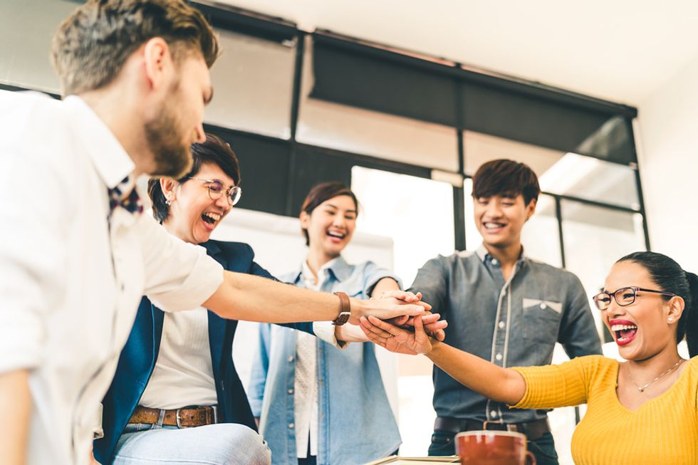 Co-workers connecting and working together as a team