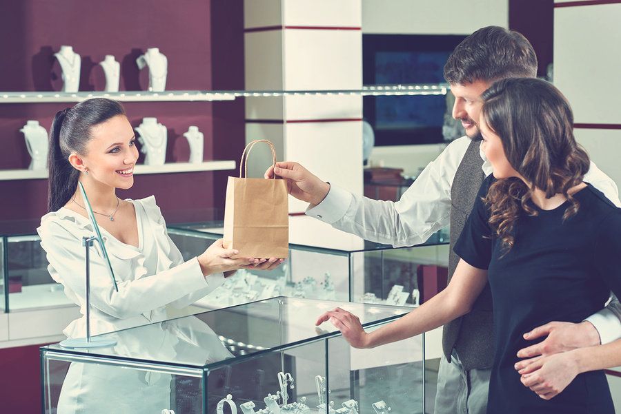 Young woman works a seasonal retail job during the holiday season.