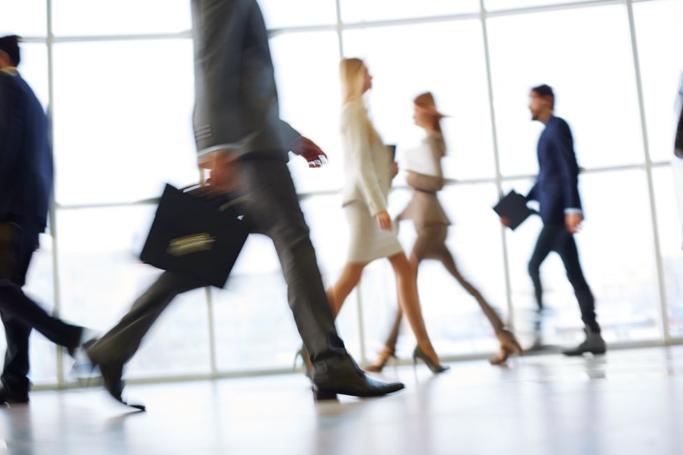 Employee rush to get to work early.
