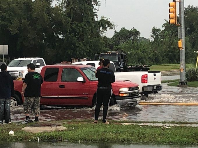 HEROIC MOMENT: Aldine running back Jayden Payne pulls woman, child from flood waters