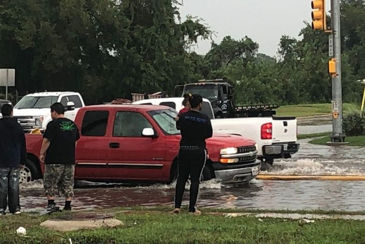 HEROIC MOMENT: Aldine running back Jayden Payne pulls woman, child from flood waters