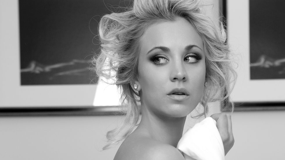 Kaley Cuoco wrapped in bed sheets