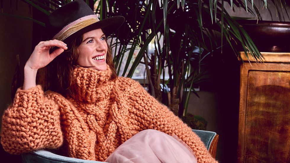 Rose Leslie in cozy orange sweater