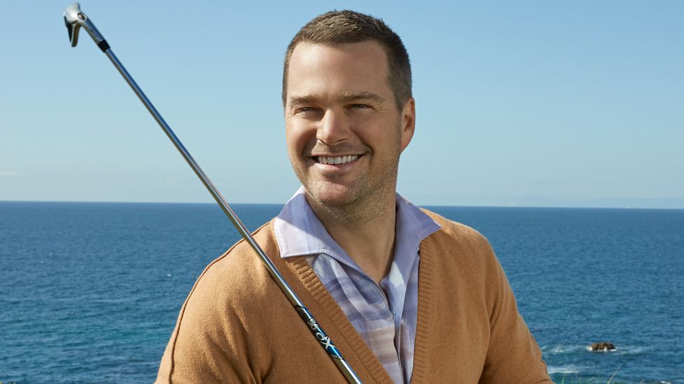 Chris ODonnell of NCIS Los Angeles holding a golf club