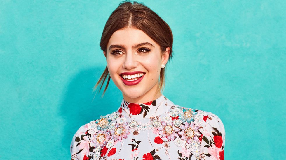 Sami Gayle of Blue Bloods in a bright floral shirt