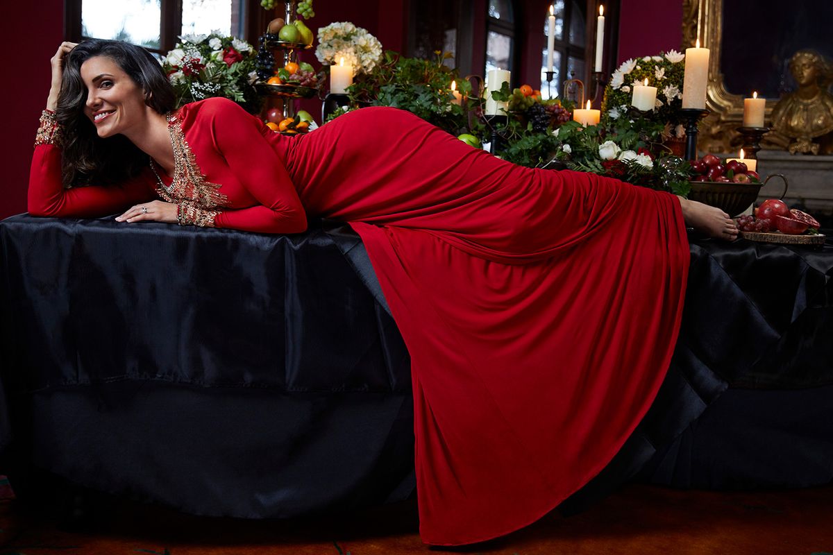 Daniela Ruah of NCIS Los Angeles in red and gold dress
