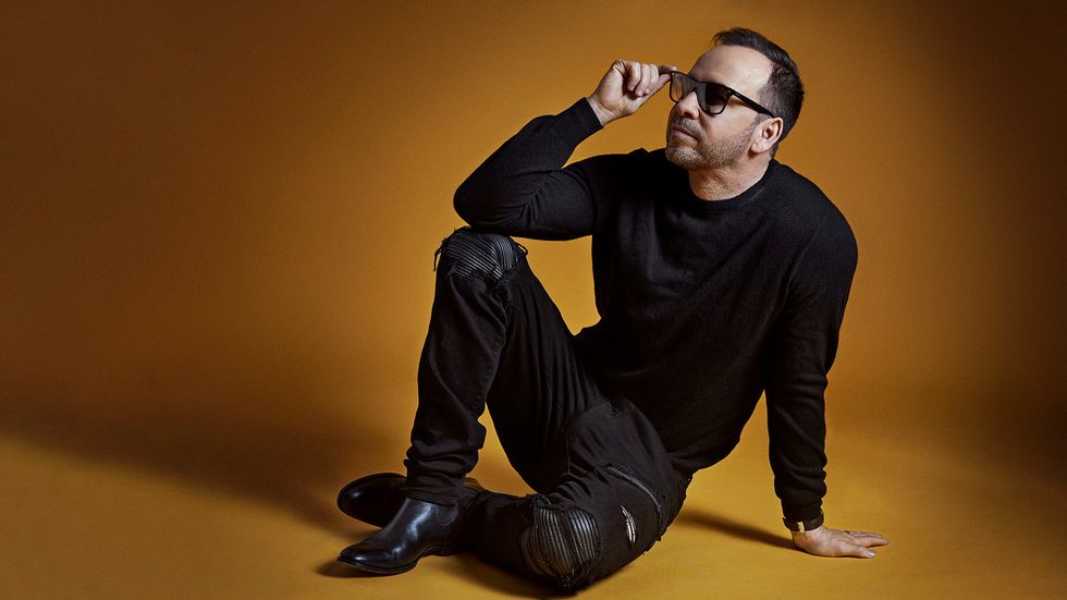 Donnie Wahlberg wearing sunglasses dressed all in black