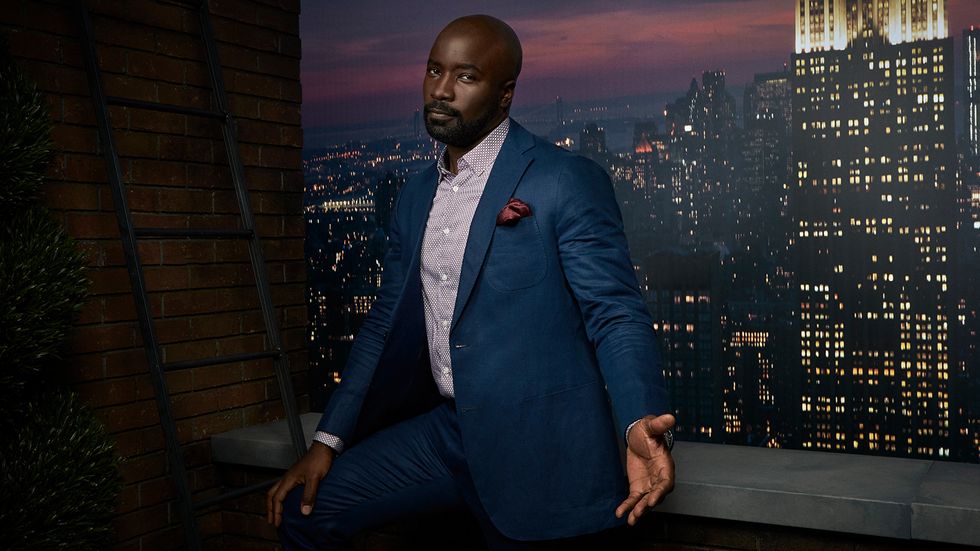 Mike Colter in front of New York City scene