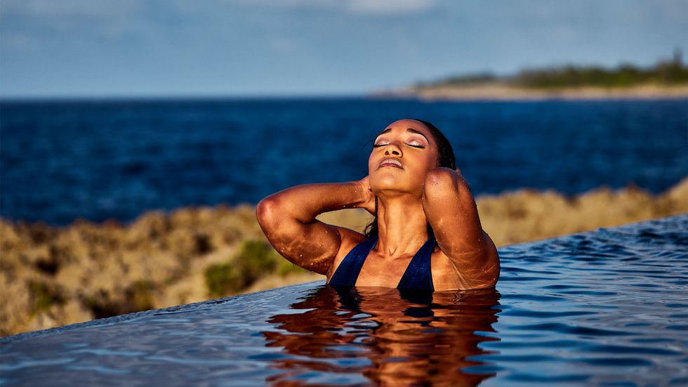 Candice Patton swimming in infinity pool