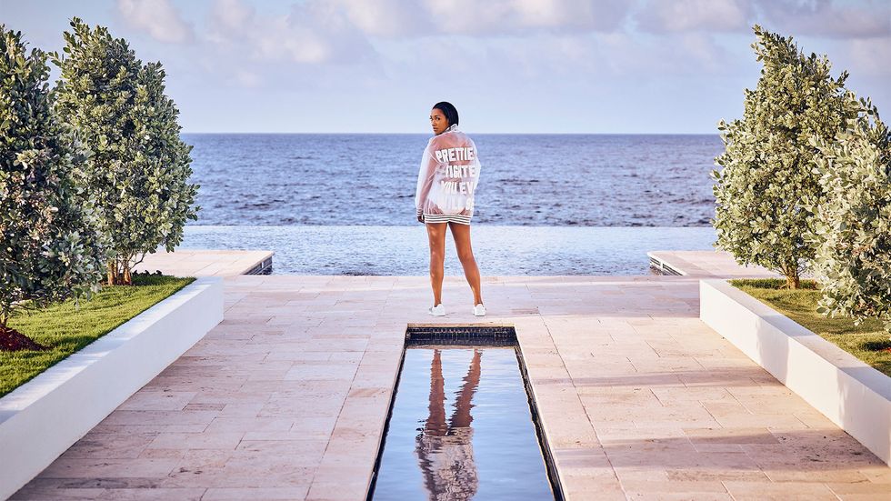 Candice Patton posing by infinity pool
