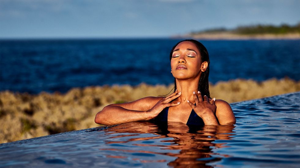 Candice Patton swimming in infinity pool