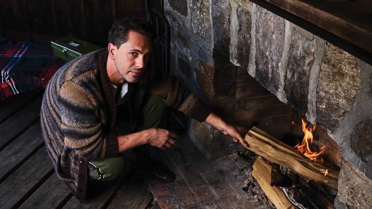 Thomas Sadoski making a fire.