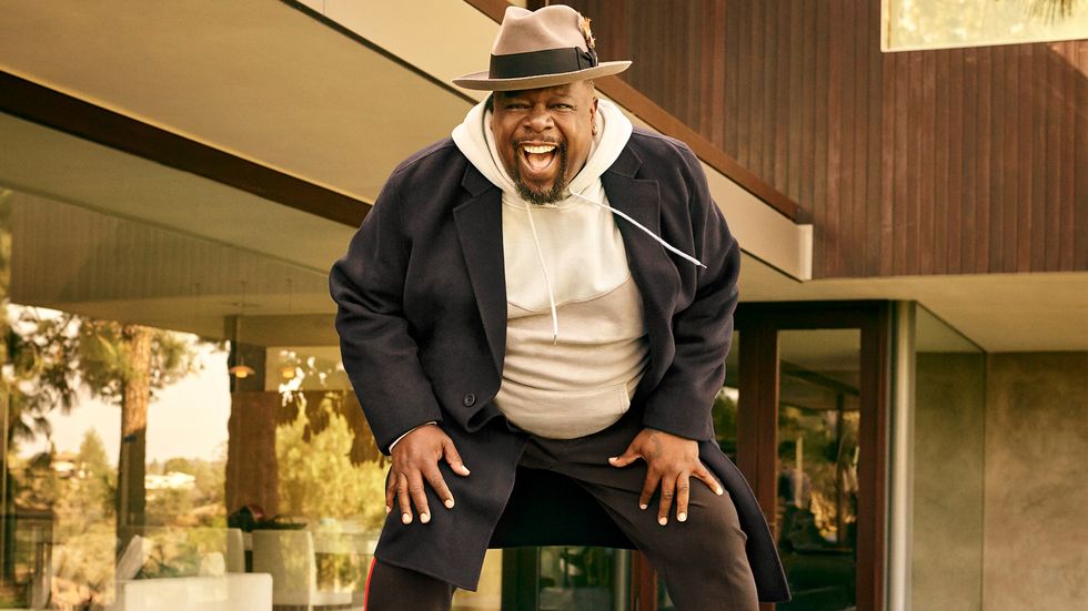 Cedric the Entertainer of The Neighborhood in hoodie and fedora