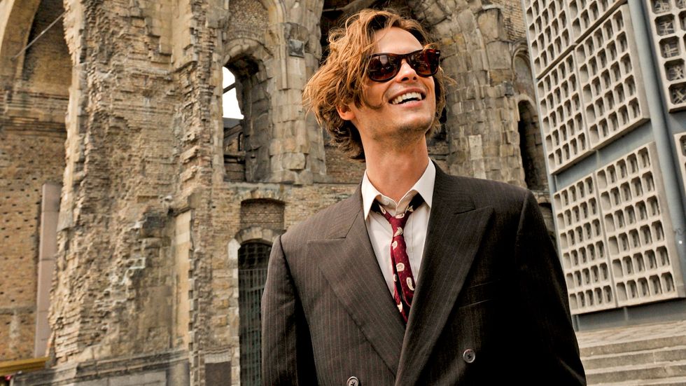 Matthew Gray Gubler of Criminal Minds in brown suit with sunglasses