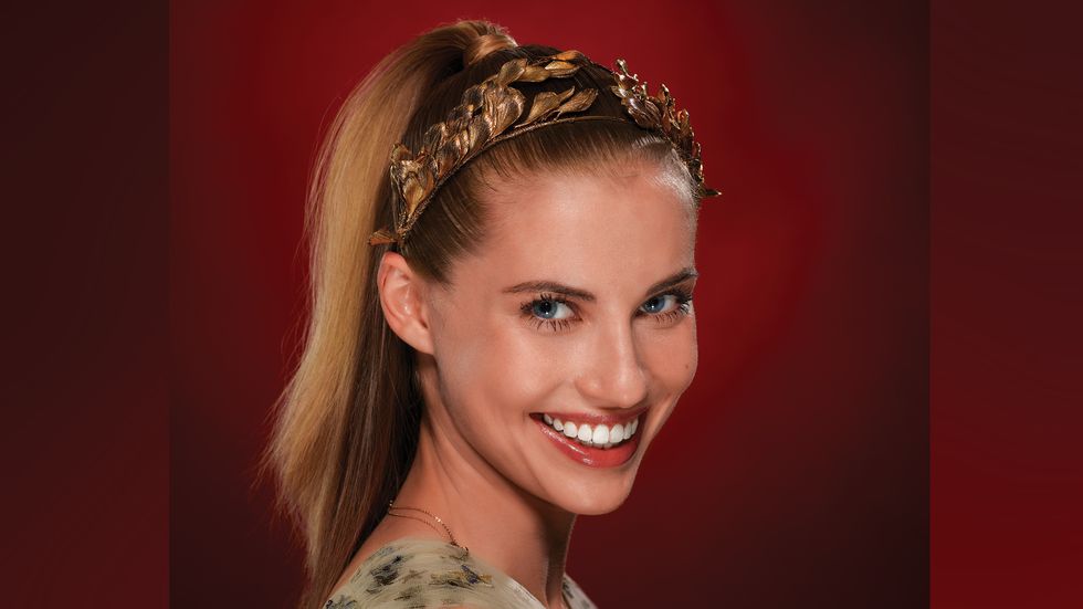 Wallis Currie Wood of Madam Secretary in gold leaf headband