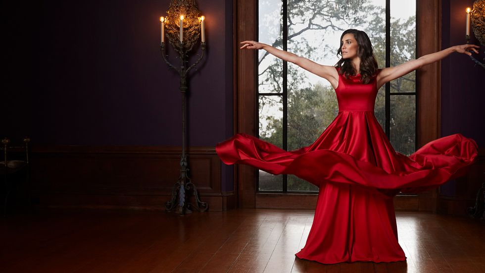 Daniela Ruah in a flowing red dress