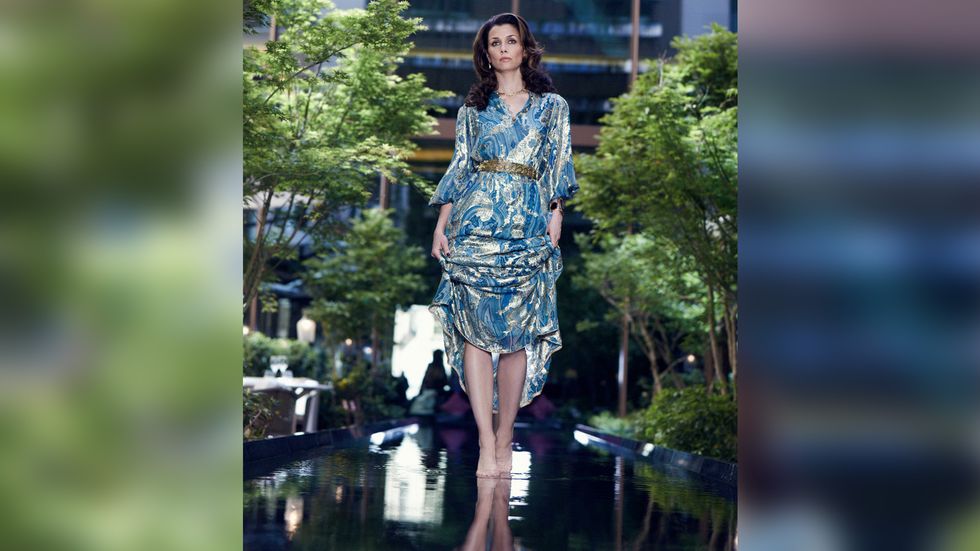 Bridget Moynahan in blue dress and gold belt
