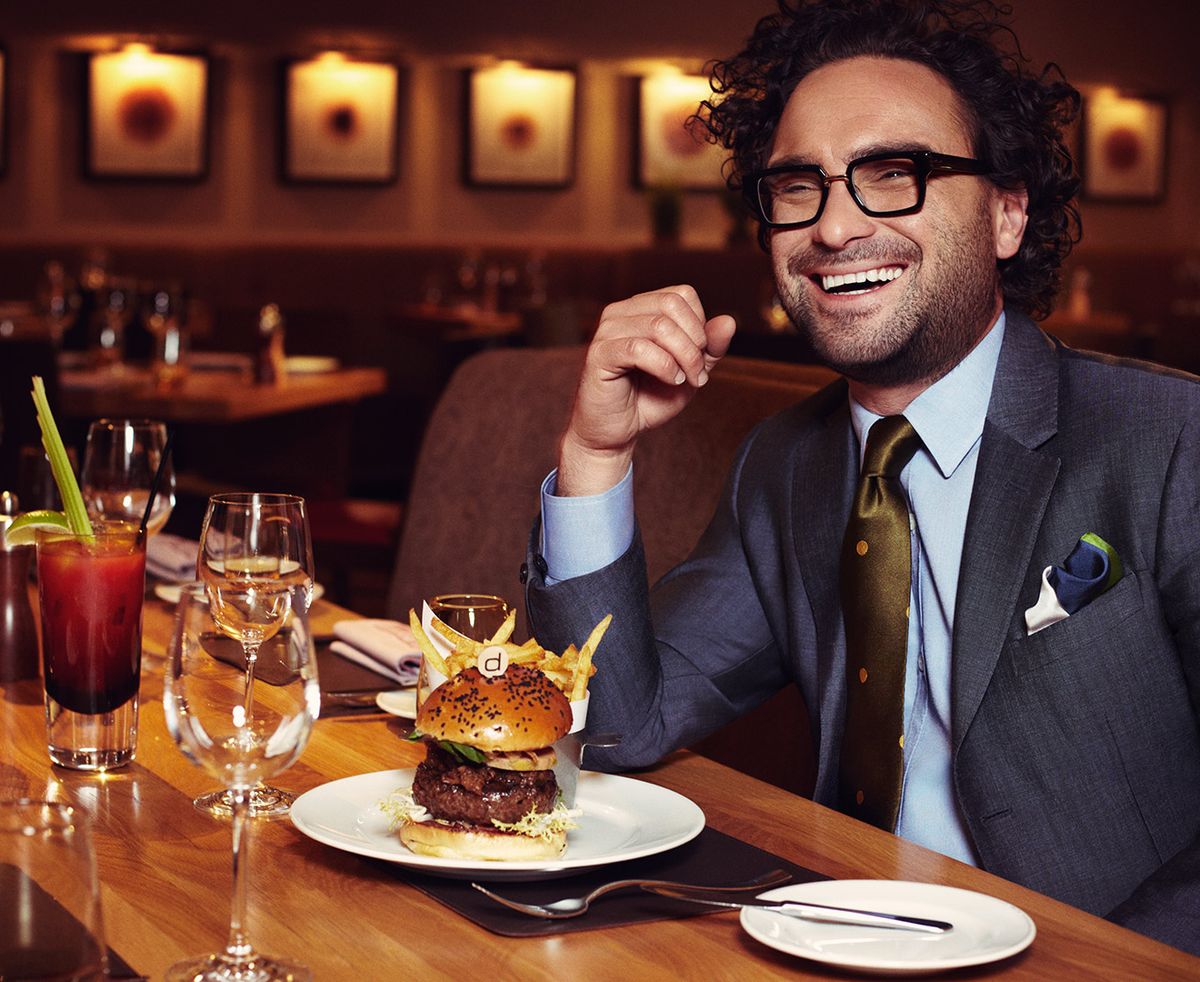 Johnny Galecki eating a burger and fries 
