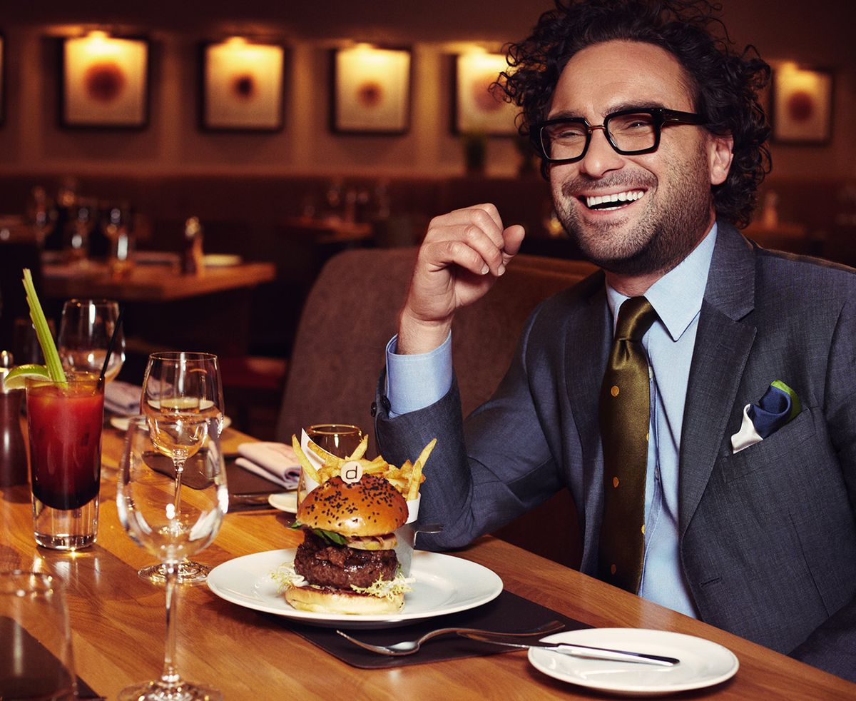 Johnny Galecki eating a burger and fries