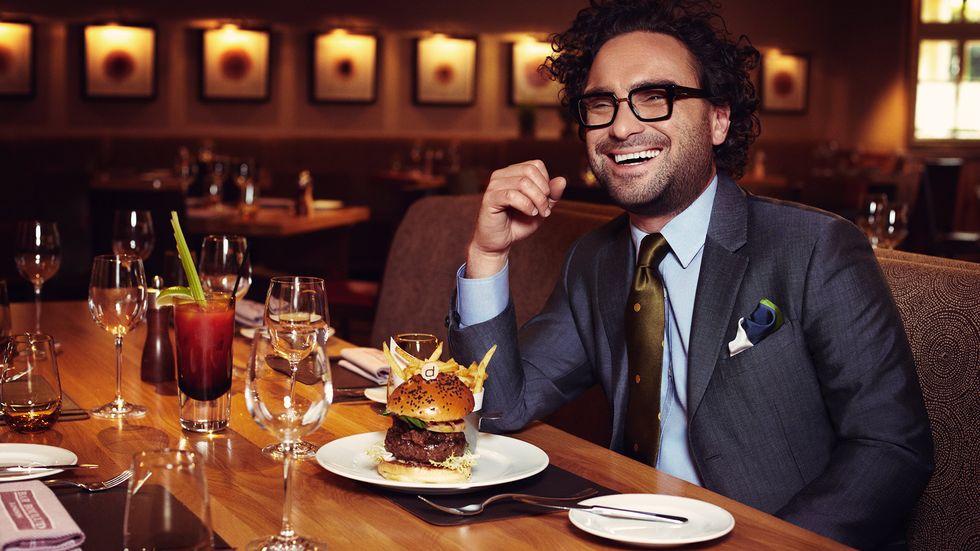 Johnny Galecki eating a burger and fries