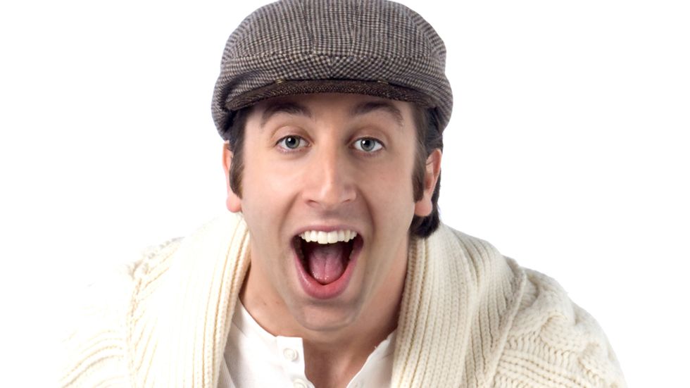 Simon Helberg lauding with white sweater