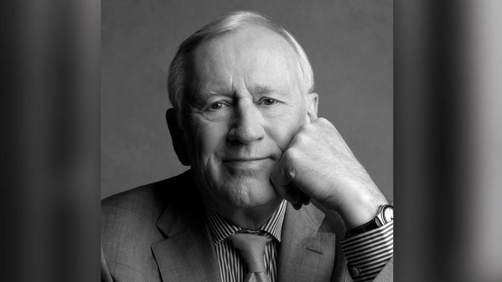 Len Cariou close up in grey suit and tie