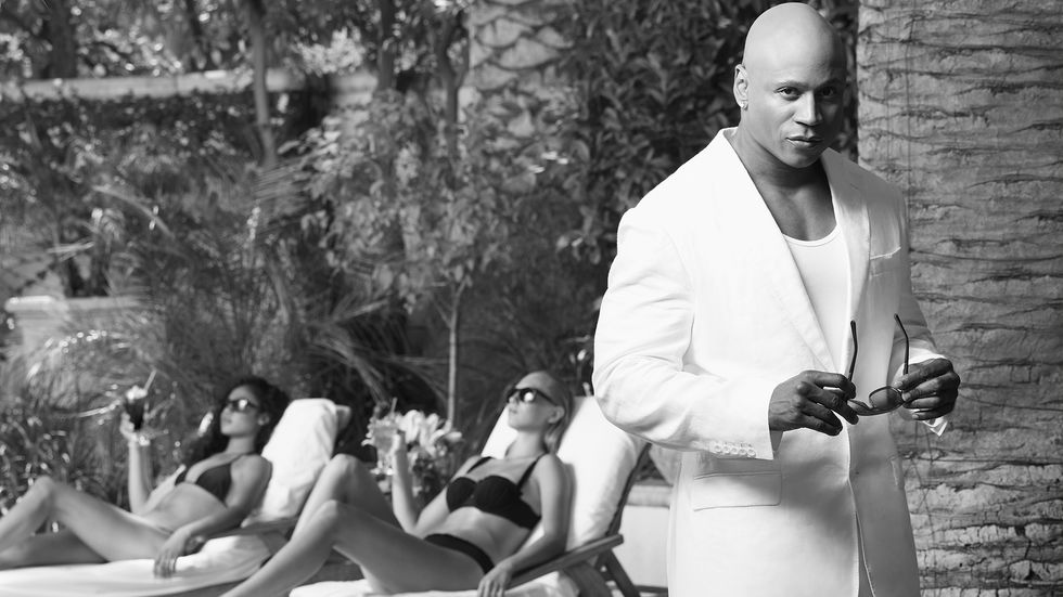 LL COOL J wears a white suit poolside