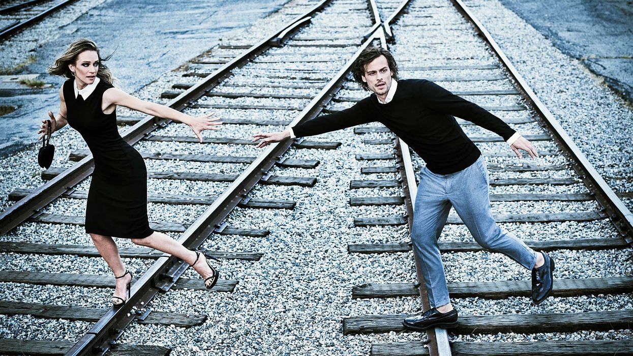 Matthew Gray Gubler and A J Cook running on railroad tracks