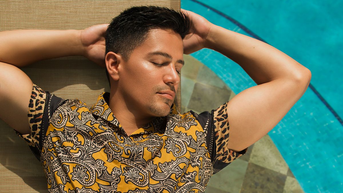 Jay Hernandez laying by the pool