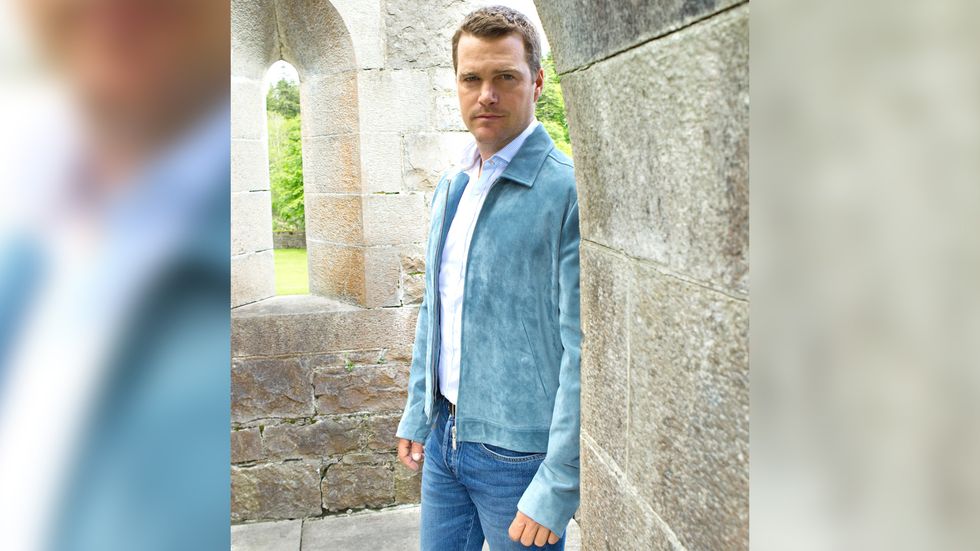 Chris ODonnell in blue jacket and denim pants