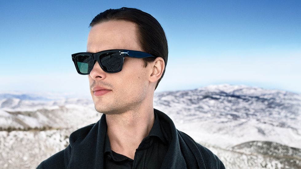 Matthew Gray Gubler in black sunglasses with snow capped mountains