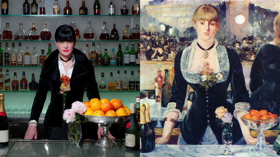 Pauley Perrette of Broke behind a bar and a bowl of oranges recalling an impressionist painting by Manet